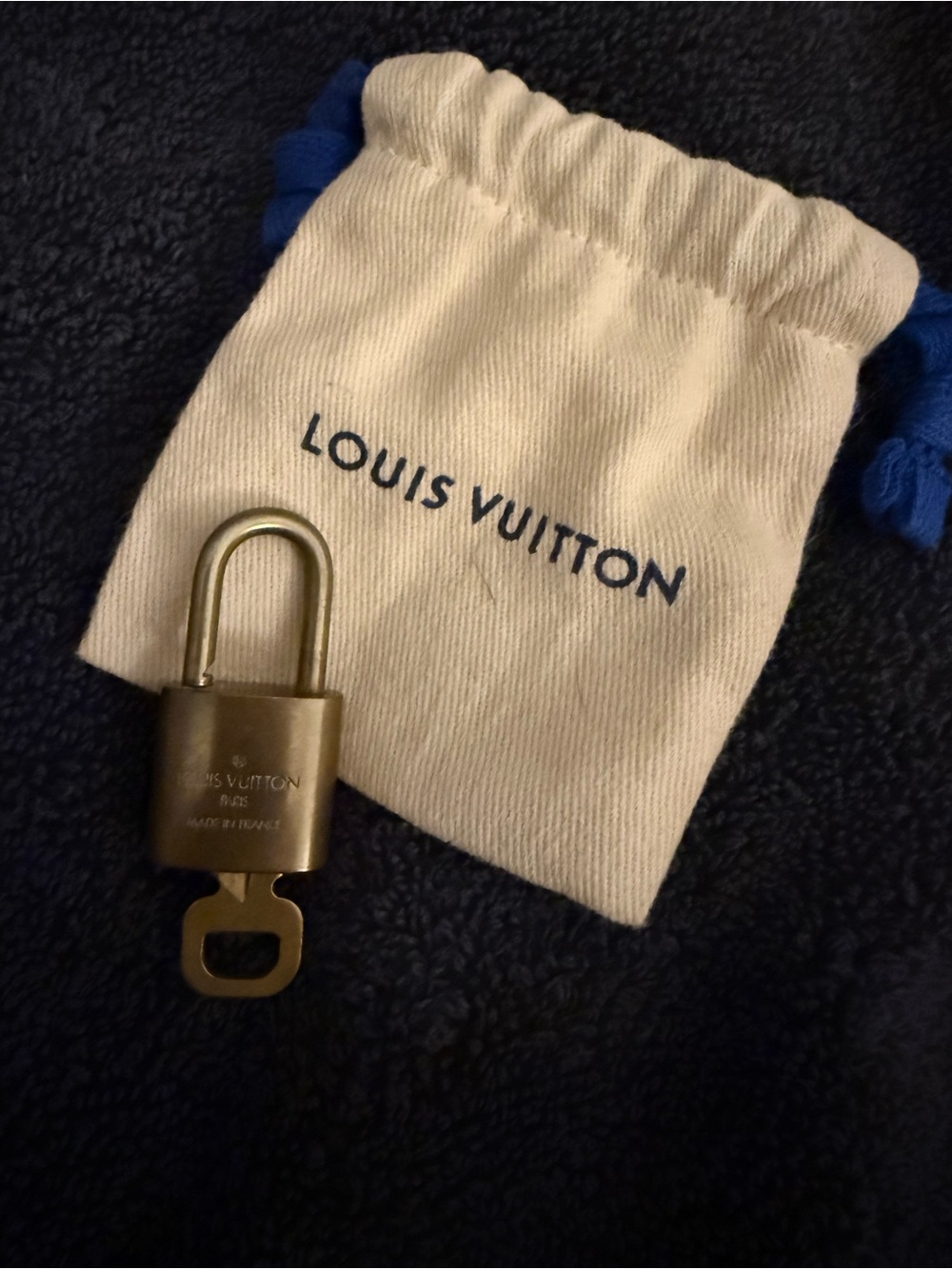 Louis Vuitton Brass Padlock with Cream Dust Bag and Blue Drawstrings